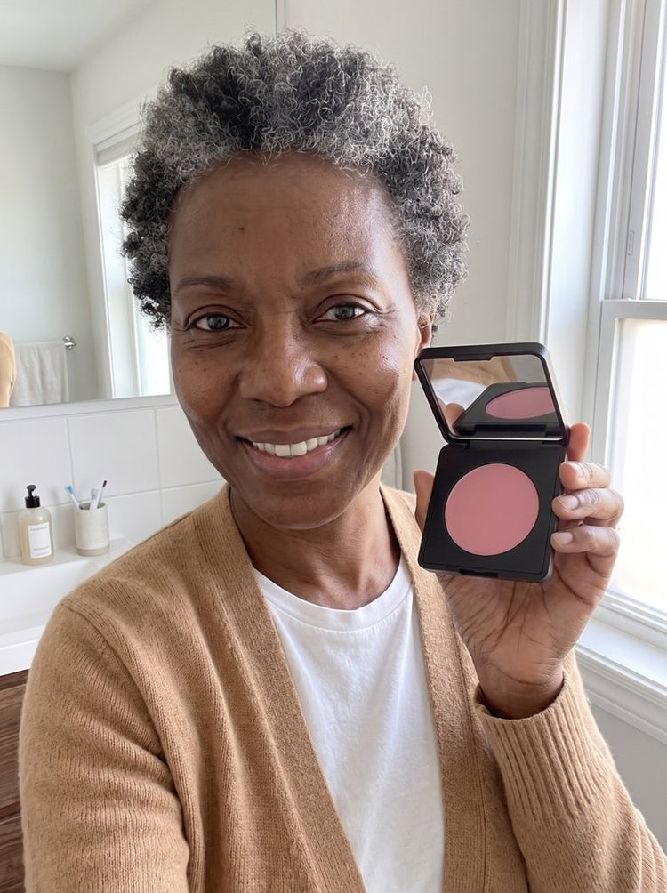 Jessica at home with the brightener on, holding the compact
